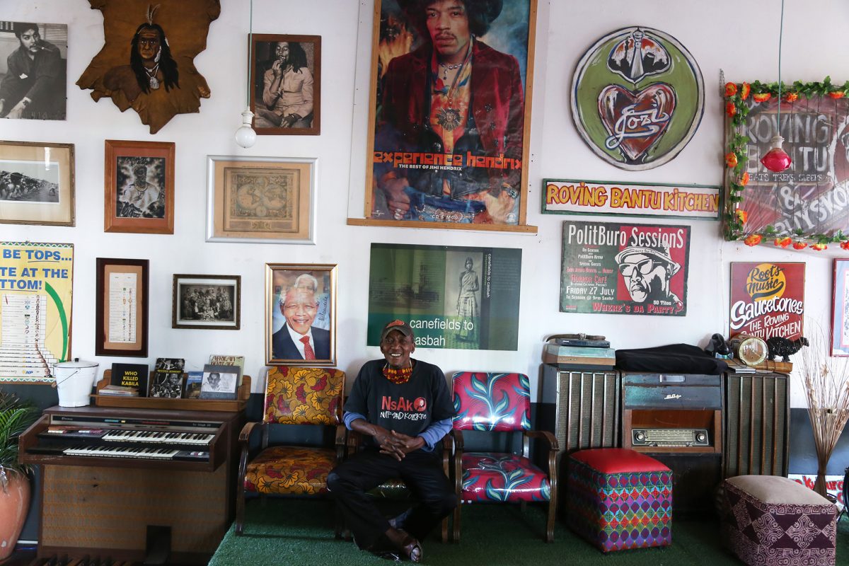 Bantu Shrine A visual journey of finding how some individuals in Johannesburg , South Africa are adapting their lives around Covid 19 Lockdown regulations.
Human beings are used to routine, so what happens when that routine is suddenly disrupted? When confined at home how do you adapt to that limited space? How do you find new ways to breathe?
Driven by curiosity I called on couple of people that I know, just ordinary people in Society. So this is a visual journey of selected few who were brave enough to allow me into their space exploring how they were coping with Lockdown.
• Sifiso Ntuli- owner of Bantu Roving Kitchen. Since no restaurant was to be open, he opened his space as a soup kitchen area and through donations he offe
Curiosity led me to Sifiso Ntuli, co-owner of Roving Bantu Kitchen in Brixton. Before lockdown, Roving Bantu was a vibrant meeting place that offered live music, great food and was a place that many people regarded as home.
During lockdown, Ntuli was part of a soup kitchen started to provide those in need with a cooked lunch.
After the reopening of businesses, Ntuli has had to move his restaurant from Caroline Street to his home in Brixton.
He explains that Covid-19 made him reflect on a new business model. “Although I have had to close, I’m not shutting down!” he says. The venue will now accommodate small groups of about 20 people for a Roving Bantu dining experience.
On the day that the image was made, Ntuli was busy planning for the soup kitchen. The city was very quiet, like a ghost city. When I went in, he was with one of his assistants, just outside at the back.
He was in a meditative kind of mood. We talked quite a bit. I took some images outside, and then I asked him what his favourite spot was in the place. He pointed to where he was seated. Even without him, it is quite a space. There is a journey there; a story of a man who has accu- mulated all those experiences and tried to put them together. You can tell what kind of a business he