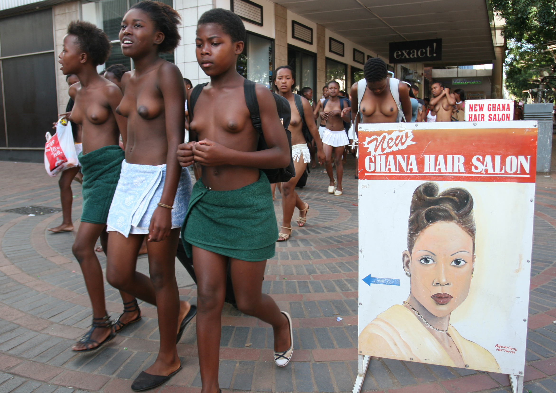 Teenage girls go back home after undergoing a virginity test on sunday 18 February in Pietmaritzburtg town about 480 kilometers from Johnnesburg.There were 200 girls aged between 6 and 31 years who underwent the process and declared as virgins.Although human rights activists have been condemming this Zulu culture as demeaning and incorrect the women elders who carry it out have vowed that it must continue.They argue that it prevents the spread of HIV and also gives self esteem to those who are declared as virgins.Photo Antony Kaminju