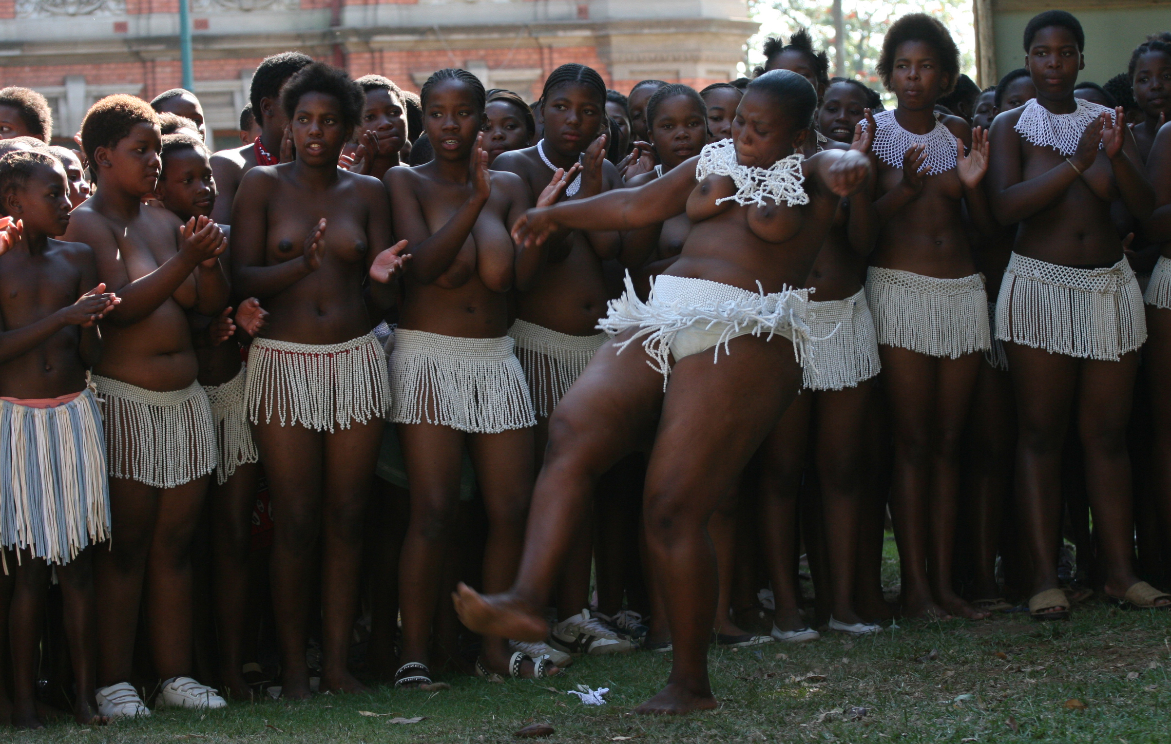 virgin6_3181 Teenage girls dance traditional songs after undergoing a virginity test on sunday 18 February in Pietmaritzburtg town about 480 kilometers from Johnnesburg.There were 200 girls aged between 6 and 31 years who underwent the process and declared as virgins.Although human rights activists have been condemming this Zulu culture as demeaning and incorrect the women elders who carry it out have vowed that it must continue.They argue that it prevents the spread of HIV and also gives self esteem to those who are declared as virgins.Photo Antony Kaminju
